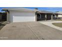 Spacious driveway leading to the house's garage at 4054 E Clovis Cir, Mesa, AZ 85206