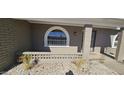 Partial view of the house exterior showcasing a unique arched window at 4054 E Clovis Cir, Mesa, AZ 85206