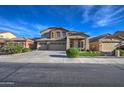 Two-story house with a three-car garage and well-maintained landscaping at 46107 W Morning View Ln, Maricopa, AZ 85139