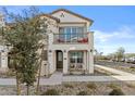 Two-story townhome with balcony, landscaping, and walkway at 4717 S Ferric --, Mesa, AZ 85212