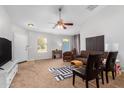 Living room with brown couches and a large TV at 509 E Daniella Dr, San Tan Valley, AZ 85140