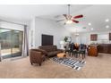 Open floor plan living room with a view into the kitchen at 509 E Daniella Dr, San Tan Valley, AZ 85140