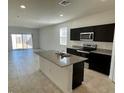 Open concept kitchen with an island and stainless steel appliances at 5501 E Rock Bush Ln, San Tan Valley, AZ 85140