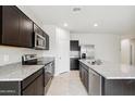 Modern kitchen with stainless steel appliances and granite countertops at 5545 E Rock Bush Ln, San Tan Valley, AZ 85140