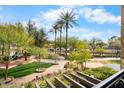 Landscaped community with walking paths and a serene waterway at 7175 E Camelback Rd # 207, Scottsdale, AZ 85251