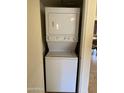 Stackable washer and dryer in a compact laundry closet at 7510 E Thomas Rd # 134, Scottsdale, AZ 85251