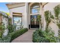 Elegant entryway with double doors and lush landscaping at 7705 E Doubletree Ranch Rd # 55, Scottsdale, AZ 85258