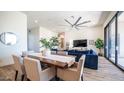 Bright dining area with a wooden table and seating for eight at 8277 E Tailspin Ln, Scottsdale, AZ 85255