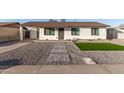 Newly remodeled home with artificial turf and gravel at 874 E Tyson St, Chandler, AZ 85225