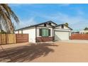 Newly built home with a modern design, clean lines, and a well-manicured yard at 902 S 96Th St, Mesa, AZ 85208