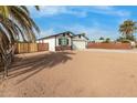 Front yard view of a newly built home with a modern design and clean lines at 902 S 96Th St, Mesa, AZ 85208