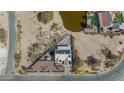 Triangular lot home with a lake view and solar panels at 10998 W San Lazaro Dr, Arizona City, AZ 85123