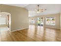 Spacious open-concept living room featuring light hardwood flooring and natural lighting at 11825 S 46Th St, Phoenix, AZ 85044