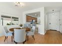 Bright dining area with wood floors and kitchen views at 1381 W Birch Rd, Queen Creek, AZ 85140