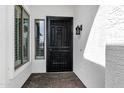 Close-up of an ornate black security door with a window, offering both security and curb appeal at 1612 E Zion Way, Chandler, AZ 85249
