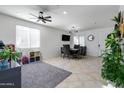 Bright dining area with dark wood table and six chairs at 21269 W Haven Dr, Buckeye, AZ 85396