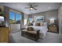 Spacious main bedroom with large windows and mountain views at 22653 W Irma Ln, Surprise, AZ 85387