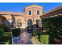Elegant entryway with stone accents and wrought iron door at 4222 E Mclellan Cir # 7, Mesa, AZ 85205