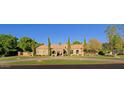 Grand estate home showcasing a classic design and manicured lawn at 4222 E Mclellan Cir # 7, Mesa, AZ 85205