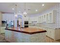 Gourmet kitchen with double ovens, large island, and custom cabinetry at 4222 E Mclellan Cir # 7, Mesa, AZ 85205