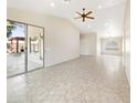 Open living area with tile floors and access to backyard at 4350 E Longhorn St, San Tan Valley, AZ 85140