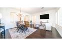 Open concept dining area with hardwood floors and modern decor at 4400 S Oleander Dr, Chandler, AZ 85248