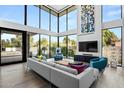 Spacious living room with floor-to-ceiling windows and comfortable seating at 4515 N 36Th Way, Phoenix, AZ 85018