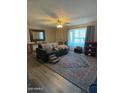Spacious living room with hardwood floors and decorative rug at 524 W Fairway Dr # 13, Mesa, AZ 85201