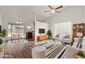 Bright living room with hardwood floors, comfortable seating, and a dining area at 5518 W Mercury Way, Chandler, AZ 85226