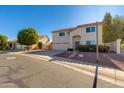 Two-story house with a two-car garage and landscaped front yard at 5731 W Aster Dr, Glendale, AZ 85304