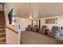 Spacious living room with comfortable seating and large TV at 5731 W Aster Dr, Glendale, AZ 85304