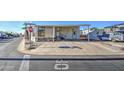 Mobile home with covered patio and parking at 7750 E Broadway Rd # 495, Mesa, AZ 85208