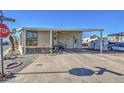 Mobile home with covered patio and parking at 7750 E Broadway Rd # 495, Mesa, AZ 85208