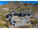 Aerial view of a house under construction with mountain backdrop at 11098 E Whistling Wind Way # 1851, Scottsdale, AZ 85255