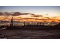 Sunset view of city lights and mountains from a construction site at 11098 E Whistling Wind Way # 1851, Scottsdale, AZ 85255