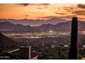 Nighttime city lights and mountain views from a hillside property at 11098 E Whistling Wind Way # 1851, Scottsdale, AZ 85255