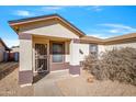 Cute single story home with front yard landscaping and a two-car garage at 11782 W Columbine Dr, El Mirage, AZ 85335