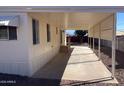 Mobile home's covered patio, offering shade and extra outdoor space at 13013 N 19Th Pl, Phoenix, AZ 85022