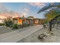 Elegant home exterior showcasing beautiful architecture and desert landscaping at 13462 E Wethersfield Rd, Scottsdale, AZ 85259