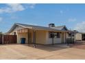 House exterior showcasing carport and gated driveway at 1416 S Lawther Dr, Apache Junction, AZ 85120