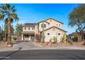 Two-story house with desert landscaping and a large driveway at 16118 W Gibson Ln, Goodyear, AZ 85338