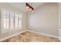 Bright dining area with large windows and tile flooring at 18487 N 111Th Dr, Surprise, AZ 85378