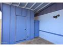 Closer view of the home's carport featuring a storage closet and privacy fence at 1905 W 2Nd St, Mesa, AZ 85201