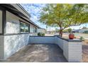 Brick patio with potted plants, offering a welcoming entrance at 2112 E Fremont Dr, Tempe, AZ 85282