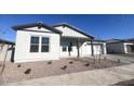 White single story house with gray accents, landscaping, and a two-car garage at 22910 E Alyssa Rd, Queen Creek, AZ 85142