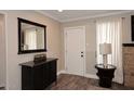 Bright entryway with a mirror, console table, and wood floors at 3502 N 22 St, Phoenix, AZ 85016