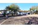 White single story home with a tile roof and mature trees at 3502 N 22 St, Phoenix, AZ 85016