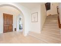 Light and airy entryway with hardwood floors and staircase at 3729 E Donald Dr, Phoenix, AZ 85050