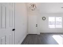 Bright and airy entryway with modern gray flooring and white doors at 3930 W Saragosa W St, Chandler, AZ 85226