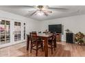 Dining area with a wood table, four chairs, and access to a patio at 4301 W Dahlia Dr, Glendale, AZ 85304